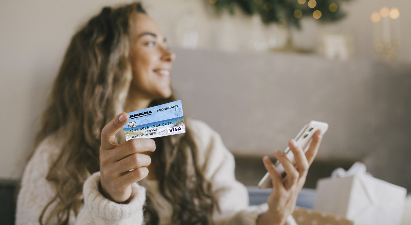 Woman holding credit card and Smartphone