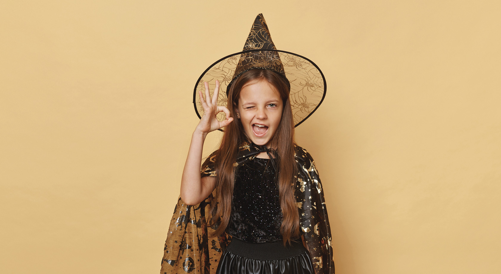 Young girl dressed as a Halloween witch